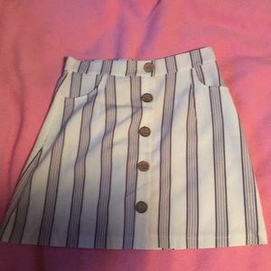 White skirt with gray stripes